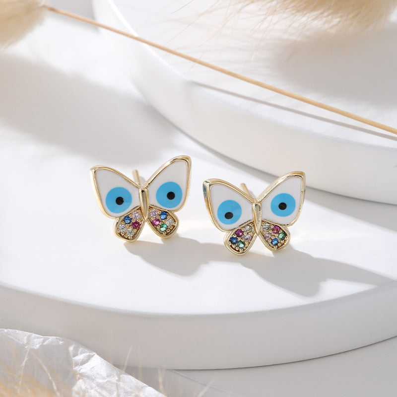 Venta al por mayor Chapado en oro Devil Eye Butterfly Cobre Ear Studs